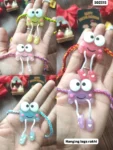 Hanging legs rakhi 455